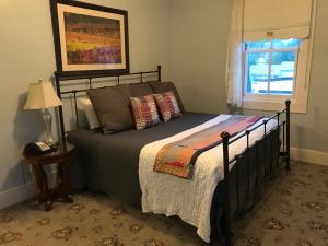 מיטה או מיטות בחדר ב-Hotel Sutter