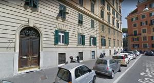 cars parked in front of a building at Marvi Hotel in Rome