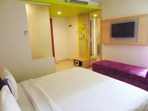 MaxoneHotels.com at Kramat tesisinde bir odada yatak veya yataklar