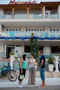 a group of people standing in front of a building at Das Maistrali 2 in Sarti