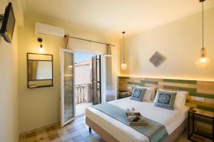 Ένα ή περισσότερα κρεβάτια σε δωμάτιο στο Villa Paxos