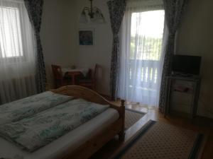 Postel nebo postele na pokoji v ubytování Gästehaus Schleich