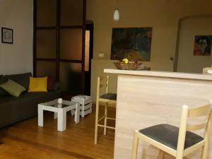 a living room with a couch and a table at Apartman Centar in Cetinje