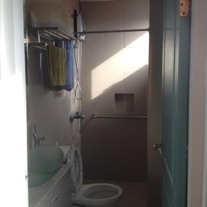 a bathroom with a toilet and a shower at W Hotel in Zamboanga