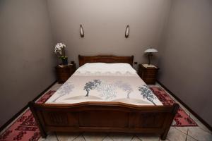 Voodi või voodid majutusasutuse Real Scampis Hotel toas