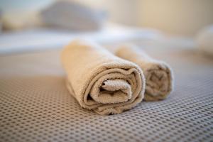 a towel laying on top of a table at Arenta Apartments in Metković +21 photos