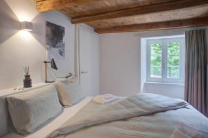 Voodi või voodid majutusasutuse MyVerzasca Resort Ai piee toas
