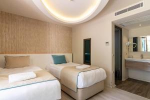 Кровать или кровати в номере The D Hotel Çeşme Resort