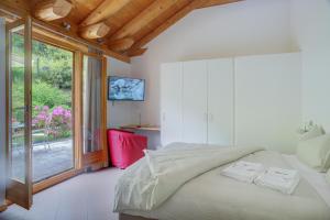 Voodi või voodid majutusasutuse MyVerzasca Resort Ai piee toas