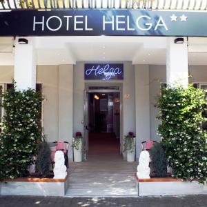 a hotel lobby with a hotel helga sign on it at Hotel Helga in Caorle