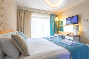 Кровать или кровати в номере The D Hotel Çeşme Resort