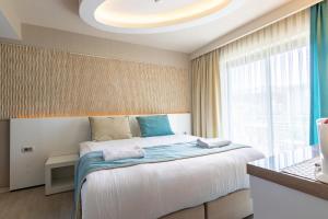 Кровать или кровати в номере The D Hotel Çeşme Resort