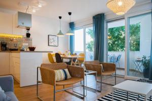 a kitchen and living room with a table and chairs at Apartment Skradinska 11 in Split