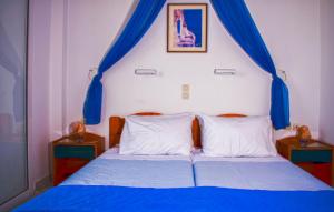 A bed or beds in a room at Hotel Helena