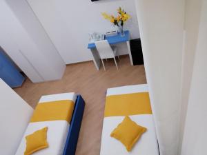 A bed or beds in a room at Affittacamere ELVI