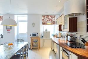 a kitchen with a counter top and a kitchen island at Crieff Armoury in Crieff