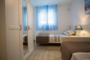 Postel nebo postele na pokoji v ubytování Cozy Coastal apartment GaMa