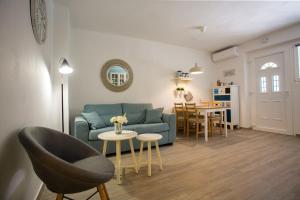 a living room with a couch and a table at Cozy Coastal apartment GaMa in Split