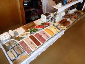 a buffet with different types of food on a table at Hali Country Hotel in Gerdi
