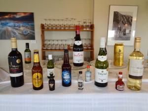 a group of bottles of wine on a table at Hali Country Hotel in Gerdi