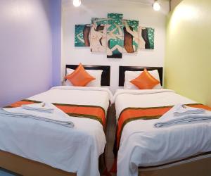 A bed or beds in a room at Casa Picasso Hotel - SHA Plus Certified