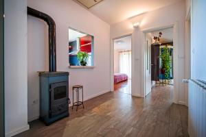 a living room with a wood stove in it at Cerin Apartment in Rovinj
