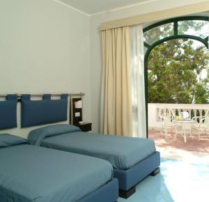 Katil atau katil-katil dalam bilik di Grand Hotel San Michele