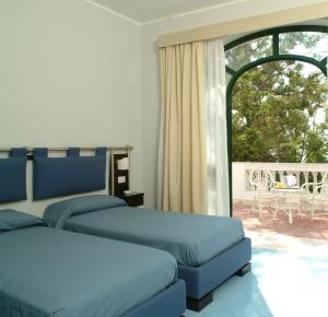 Postel nebo postele na pokoji v ubytování Grand Hotel San Michele