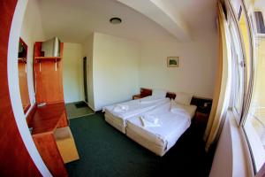 Postel nebo postele na pokoji v ubytování R&G Hotel