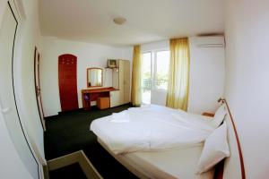 Postel nebo postele na pokoji v ubytování R&G Hotel