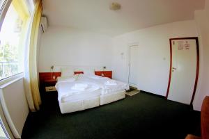 Postel nebo postele na pokoji v ubytování R&G Hotel