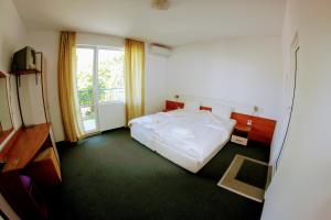 Postel nebo postele na pokoji v ubytování R&G Hotel