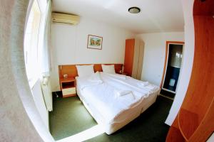 Postel nebo postele na pokoji v ubytování R&G Hotel