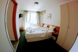 Postel nebo postele na pokoji v ubytování R&G Hotel