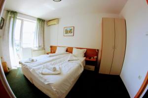Postel nebo postele na pokoji v ubytování R&G Hotel