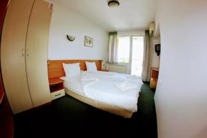 Postel nebo postele na pokoji v ubytování R&G Hotel