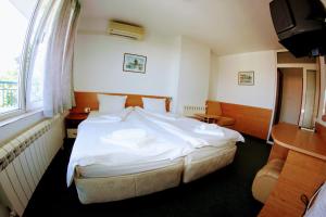 Postel nebo postele na pokoji v ubytování R&G Hotel