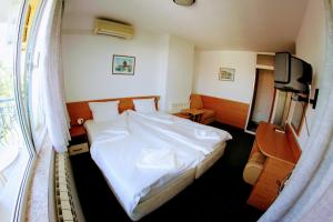 Postel nebo postele na pokoji v ubytování R&G Hotel