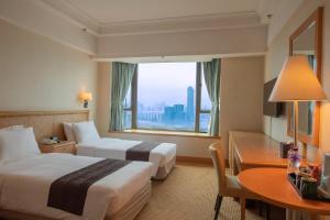 Postelja oz. postelje v sobi nastanitve Ramada Hong Kong Grand View