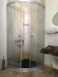 a shower with a glass enclosure in a bathroom at Alaçatı Ala Hotel - Special Category in Alaçatı +69 photos