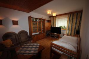 TV in/ali zabaviščno središče v nastanitvi Hotel Kleinmünchen