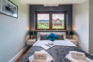 Posteľ alebo postele v izbe v ubytovaní Polana Szymoszkowa Ski Resort - My Dream Apartment