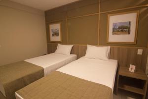 Postel nebo postele na pokoji v ubytování Hotel Privillege