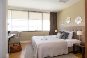 Postel nebo postele na pokoji v ubytování Boutique Hotel Lumiere + 37 fotografií
