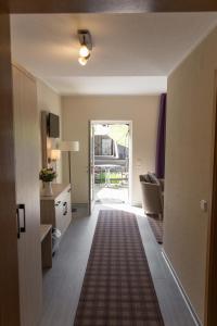 TV a/nebo společenská místnost v ubytování Hotel Garni Mühlenhof