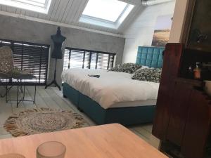 Postel nebo postele na pokoji v ubytování B&B de Petrakerk