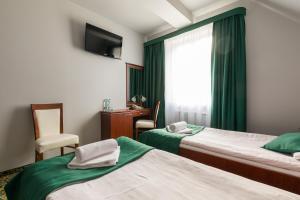 Postel nebo postele na pokoji v ubytování Hotel Skalite Spa & Wellness