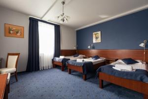 Postel nebo postele na pokoji v ubytování Hotel Skalite Spa & Wellness