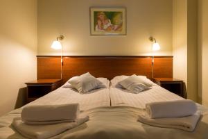 Postel nebo postele na pokoji v ubytování Hotel Skalite Spa & Wellness