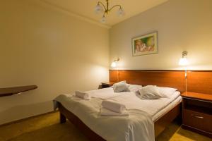 Postel nebo postele na pokoji v ubytování Hotel Skalite Spa & Wellness